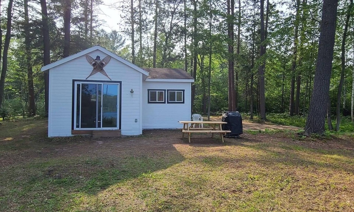 Waters Cottage | Serene cottage on private lake! Enjoy a private dock, fire pit, canoe, & more!