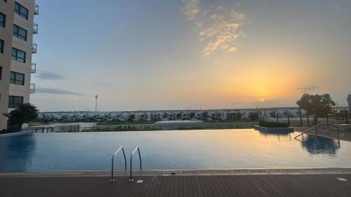 Dubai Apartment | Serene Golf Escape 2BR, Pool, Near Expo and Airport