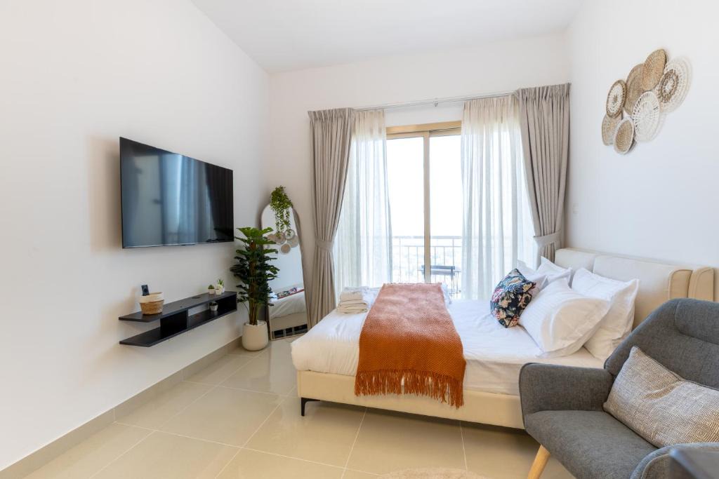 Jumeirah Village Circle Apartment | Serene studio apartment with Burj Khalifa view in Jumairah Village Circle JVC
