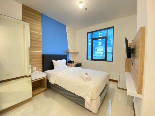 Ciroyom Apartment | Simply Studio Room Semi Apartment at The Lodge Paskal near BINUS University By Travelio