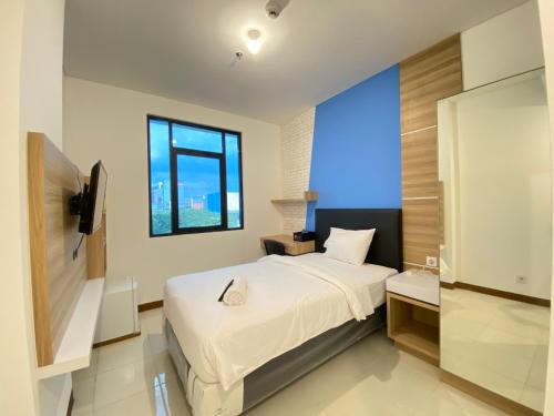 Ciroyom Apartment | Smart Studio Room Semi Apartment at The Lodge Paskal near BINUS University By Travelio