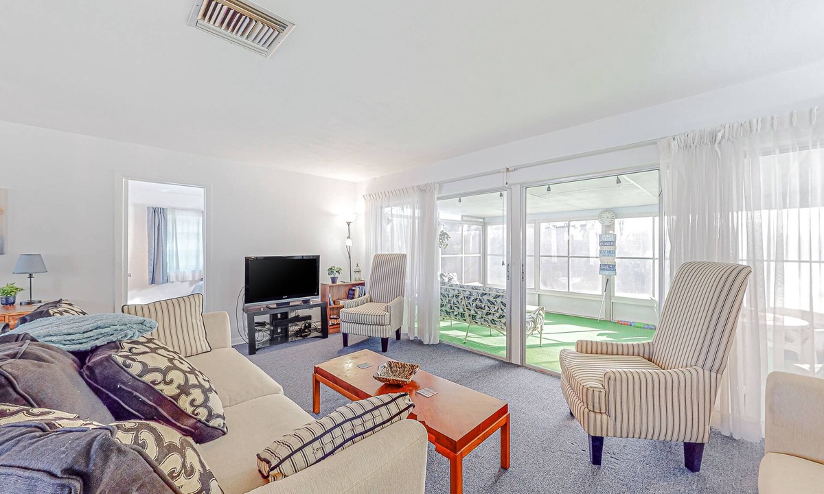 Spring Hill House | Snowbird-friendly waterfront home with water views, screened porch, streaming