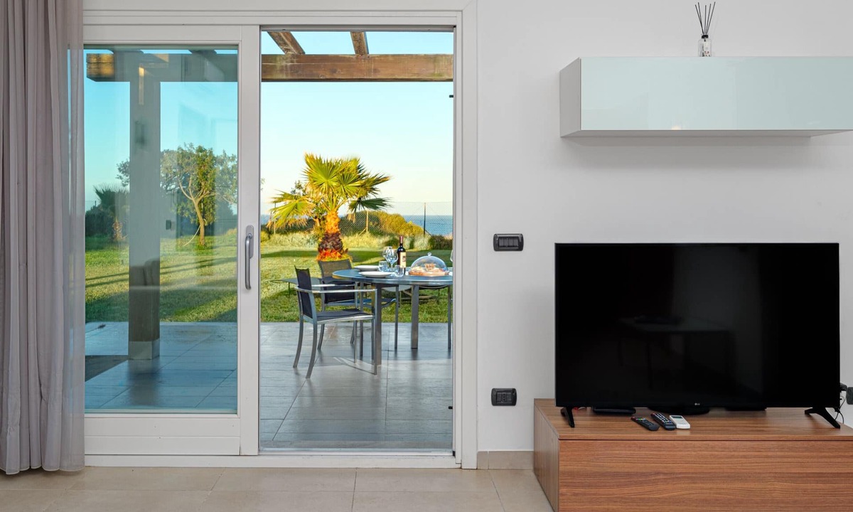 Golfo Aranci Apartment | Spacious Apartment "Villa Marconi 6" with Sea View, Private Terrace & Garden