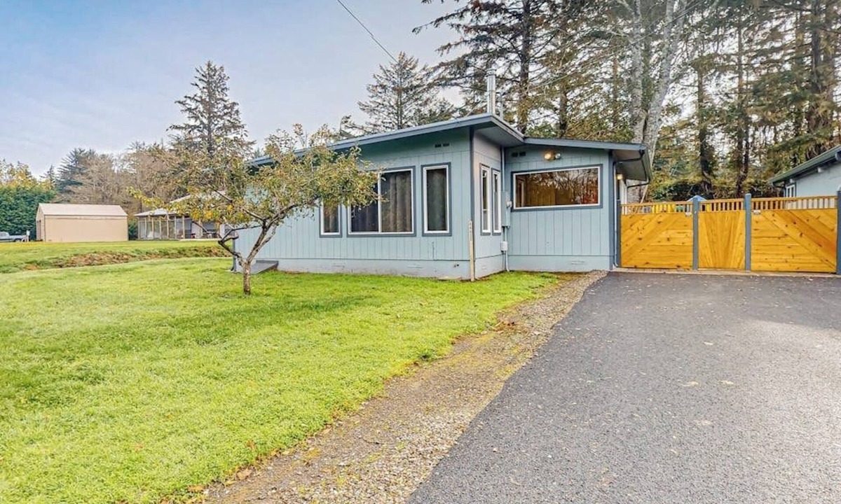 Coos Bay House | Spacious coastal property with separate living quarters, wood stove, & grill