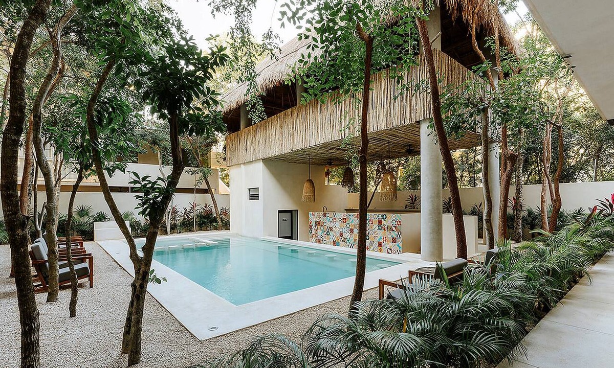 Zama Condo | Spacious modern 3-bedroom condo in Aldea Zama with premium finishes, a lush shared pool, and easy access to restaurants, shops, and Tulum’s beaches.
