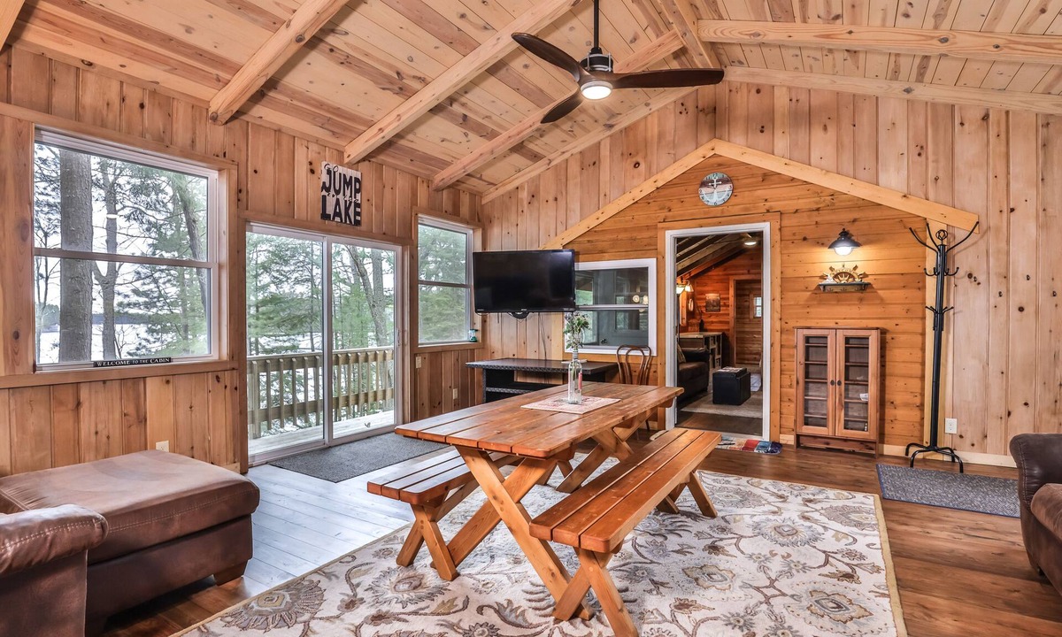 Three Lakes House | Splendid lakefront home with deck, private W/D, fireplace, and patio area