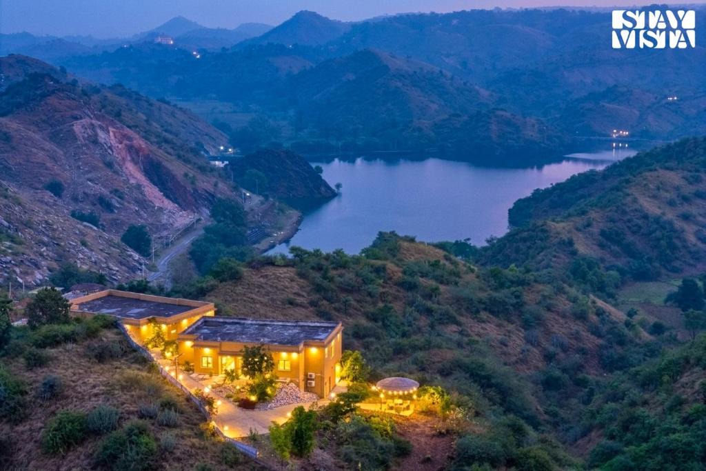 Nathdwara Villa | StayVista at Nilaya In The Hills with Lake View, Pool