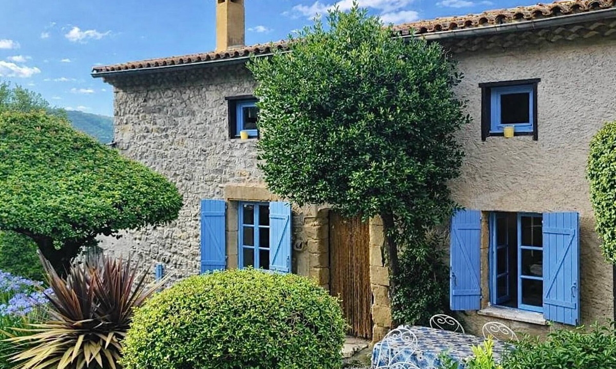 Vion House | Stone house with character, nestled in a verdant setting.