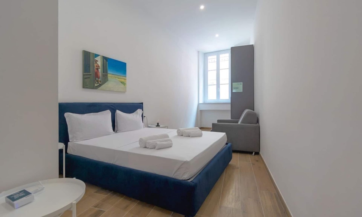 San Donato - Campidoglio Apartment | Studio apartment with double bed, armchair bed and equipped kitchenette.