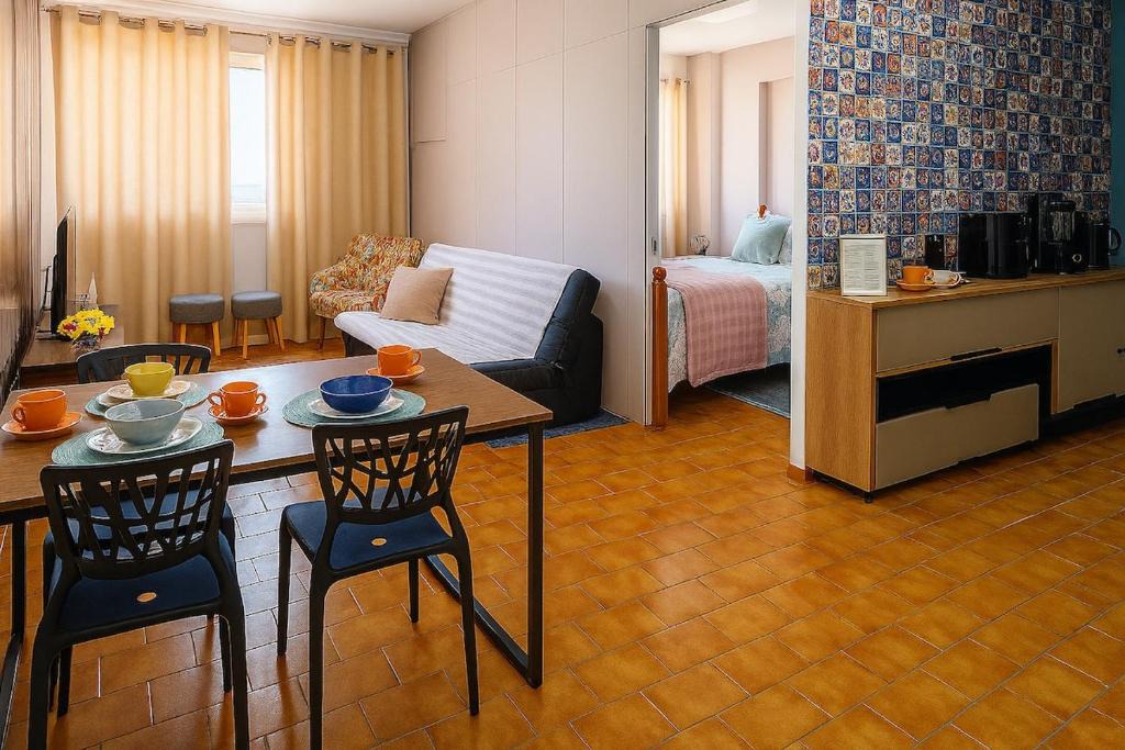 Centro - A Apartment | Studio chamorso - Cama Queen - AC - Garagem