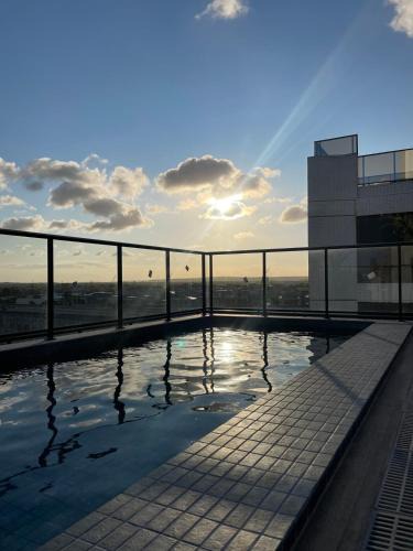 Intermares Apartment | Studio na praia Piscina, academia e lavanderia