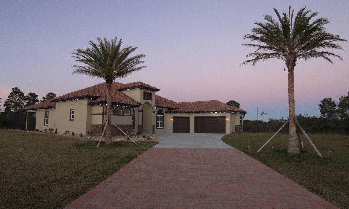 Grant-Valkaria House | Stunning Mediterranean-style vacation home w/ fabulous spillover hot tub/pool!