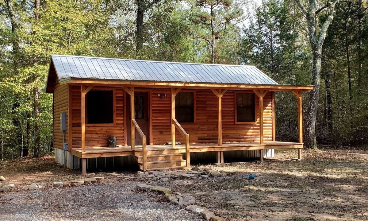Pickens Cabin | Stunning Riverfront Log Cabin Nestled Amidst Trees in Nashoba, Oklahoma
