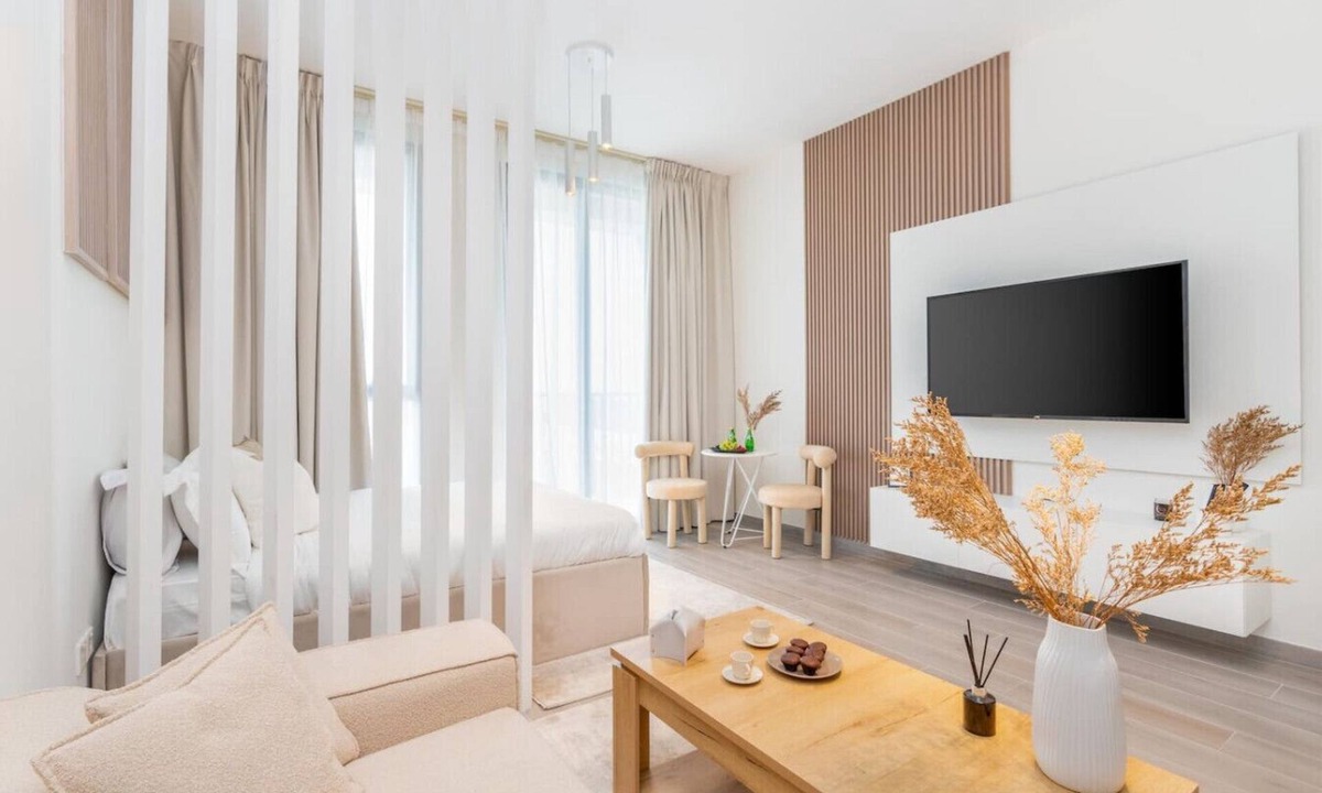 Dubai Production City Apartment | Stylish Noor 3 Studio with Poolside Views