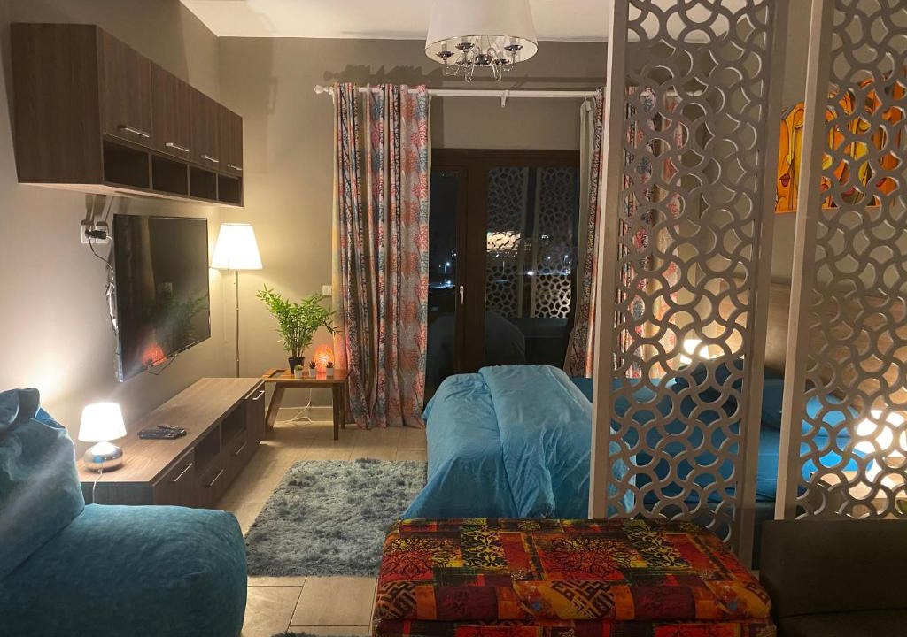 Village Road Apartment | Stylish Pool view studio in Al Dau Heights