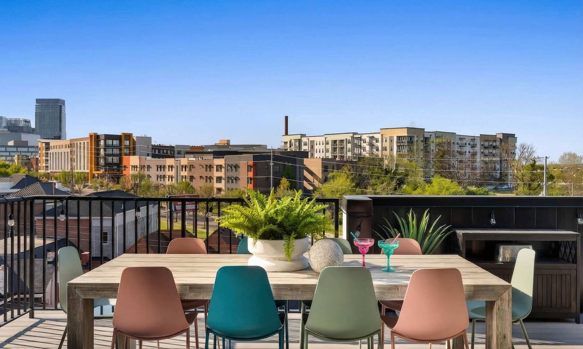 Rolling Mill Hill Apartment | Summer rooftop deck, skyline views, indoor-outdoor living near Broadway