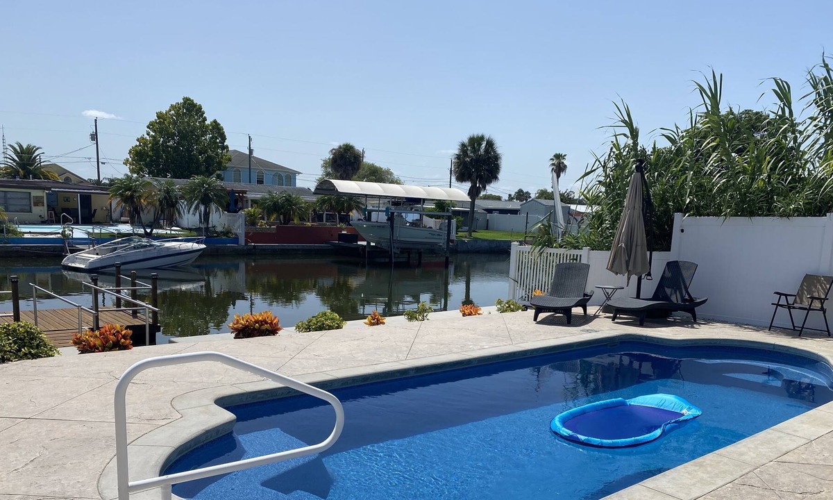 Hudson Beach Estates House | Sunny Waterfront Oasis! Private Pool, Hot Tub & Dock!