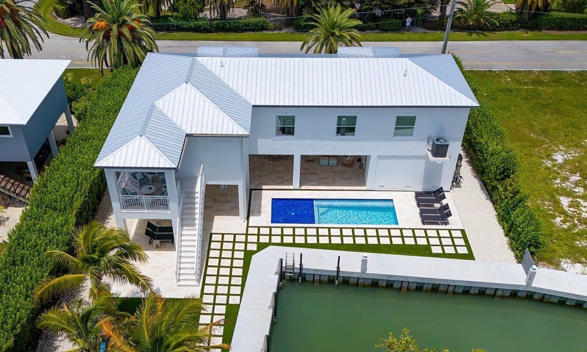 Coury House | Sunshine Getaway in Kcb Luxury Pool Home, 3BR 3BA Heated Pool Bikes Foosball Outdoor TV Pet-Friendly