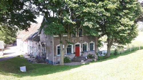 Schuwacht Bed & Breakfast | Theetuin Onder de Pannen