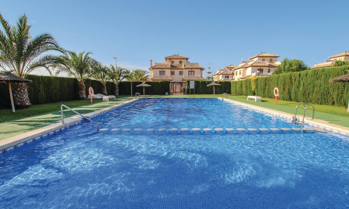 La Marina House | This beautiful vacation townhouse in La Marina on the Costa Blanca offers access to a communal pool