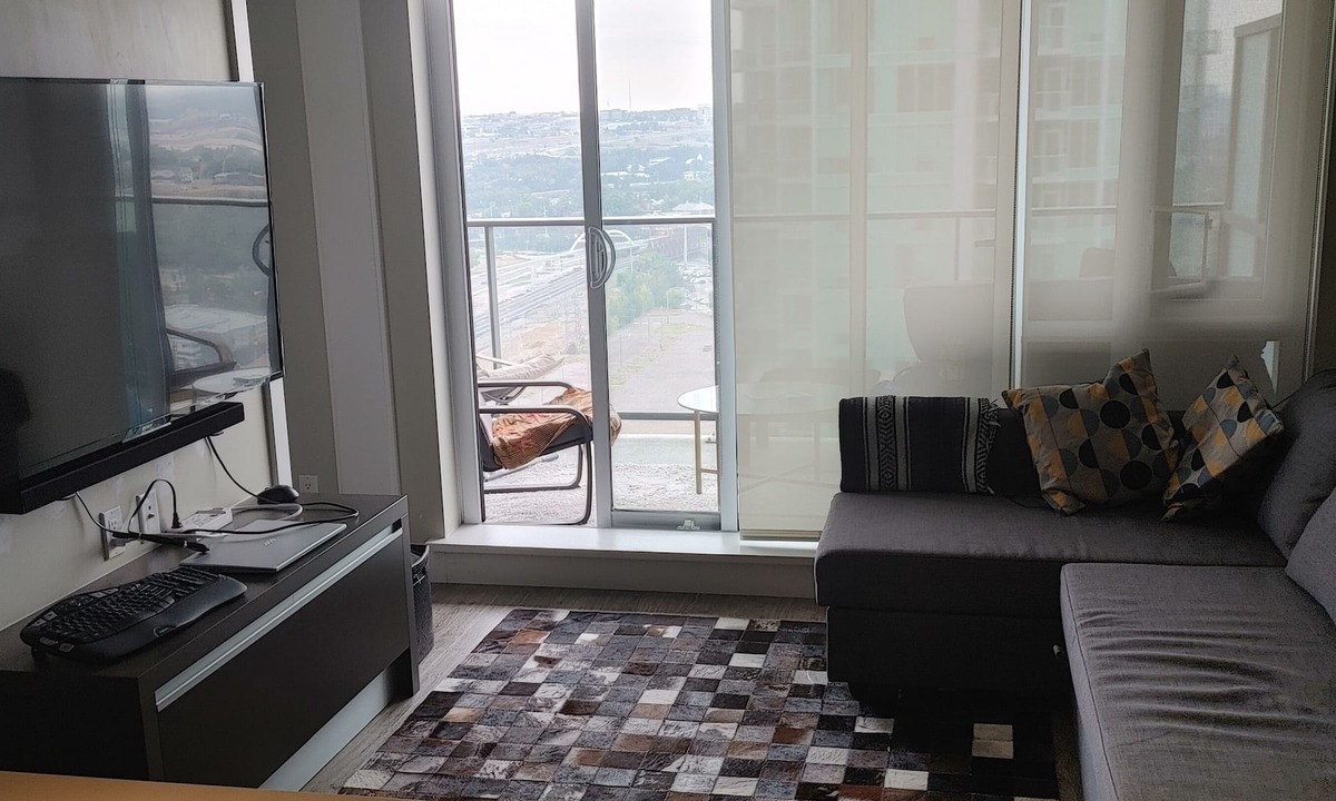 Panorama Hills Apartment | Top floor condo that is your ideal stay for Stampede