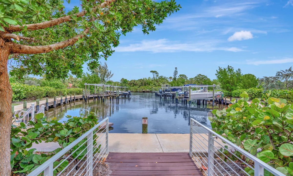 Stuart House | Tranquil Waters New Waterfront Townhome - Boat slip with lift included.