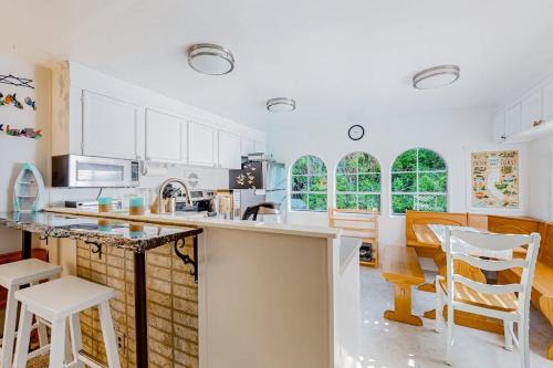 Florence House | Tree-lined coastal home with children's items gas grill and washer&dryer