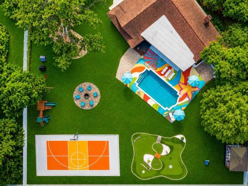 Clearwater House | Tropical pop art getaway w Pool & Game Room