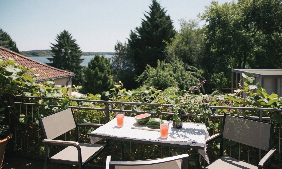 Werder Apartment | TURMVILLA upper floor: balcony, wood-burning stove and water access