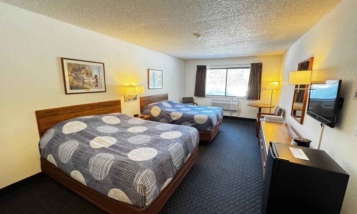 Boulder Junction Apartment | Two queen beds, private bathroom, mini fridge, and single-serve coffee maker.