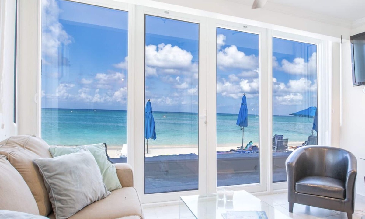 Seven Mile Beach Condo | Unique Oceanfront Condo on 7-Mile-Beach with Patio. Cayman Reef Resort # 22
