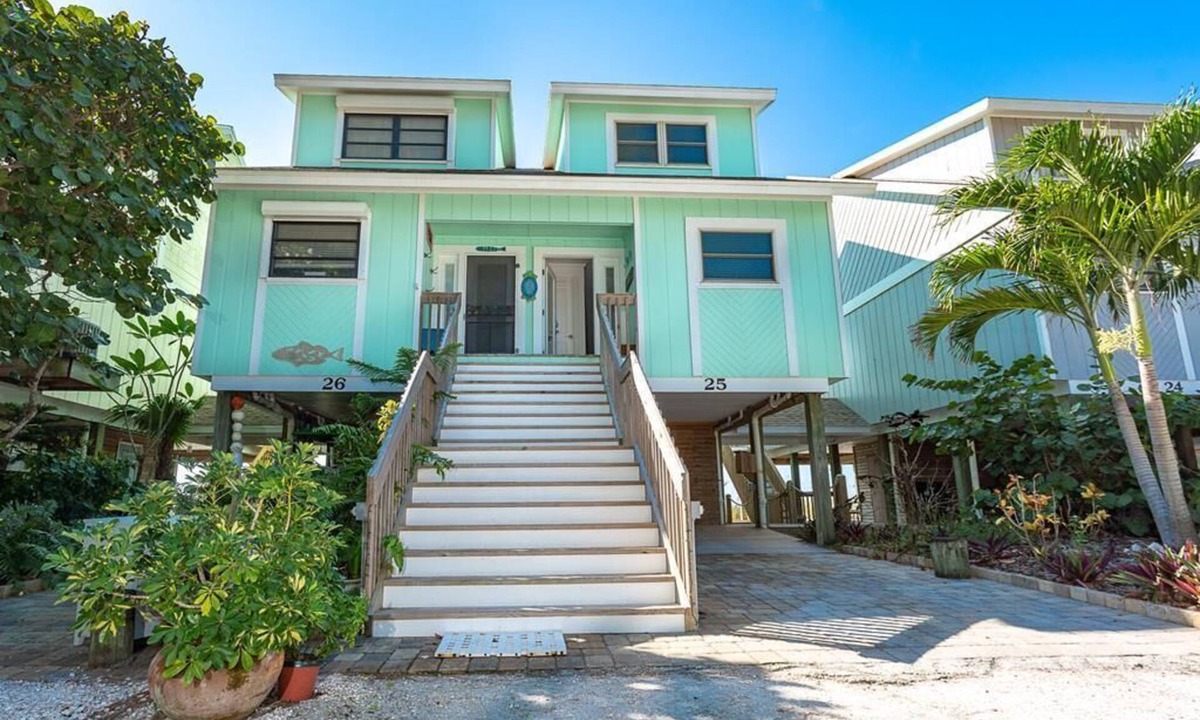 Palm Island Villa | Updated Beachfront Villa! Off the porch and onto the sand on secluded island.