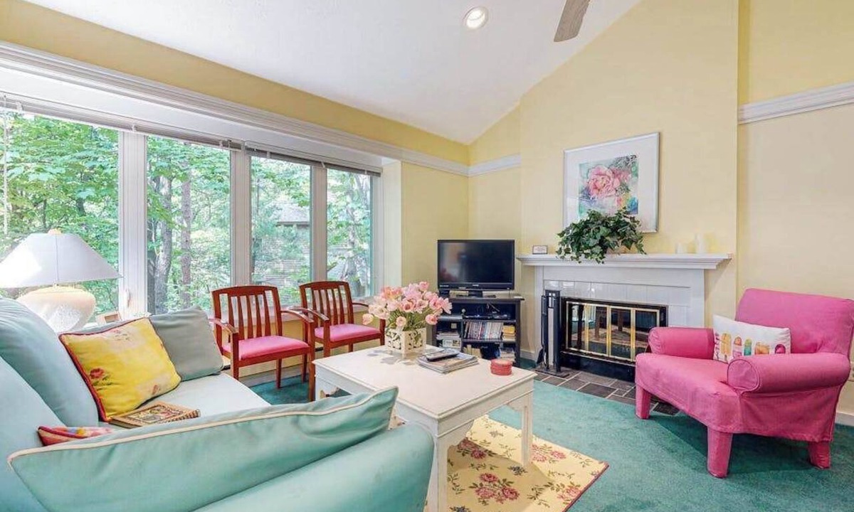 Maple City Condo | Upper-level condo with forest views, fireplace, soaking tub & high-speed WiFi