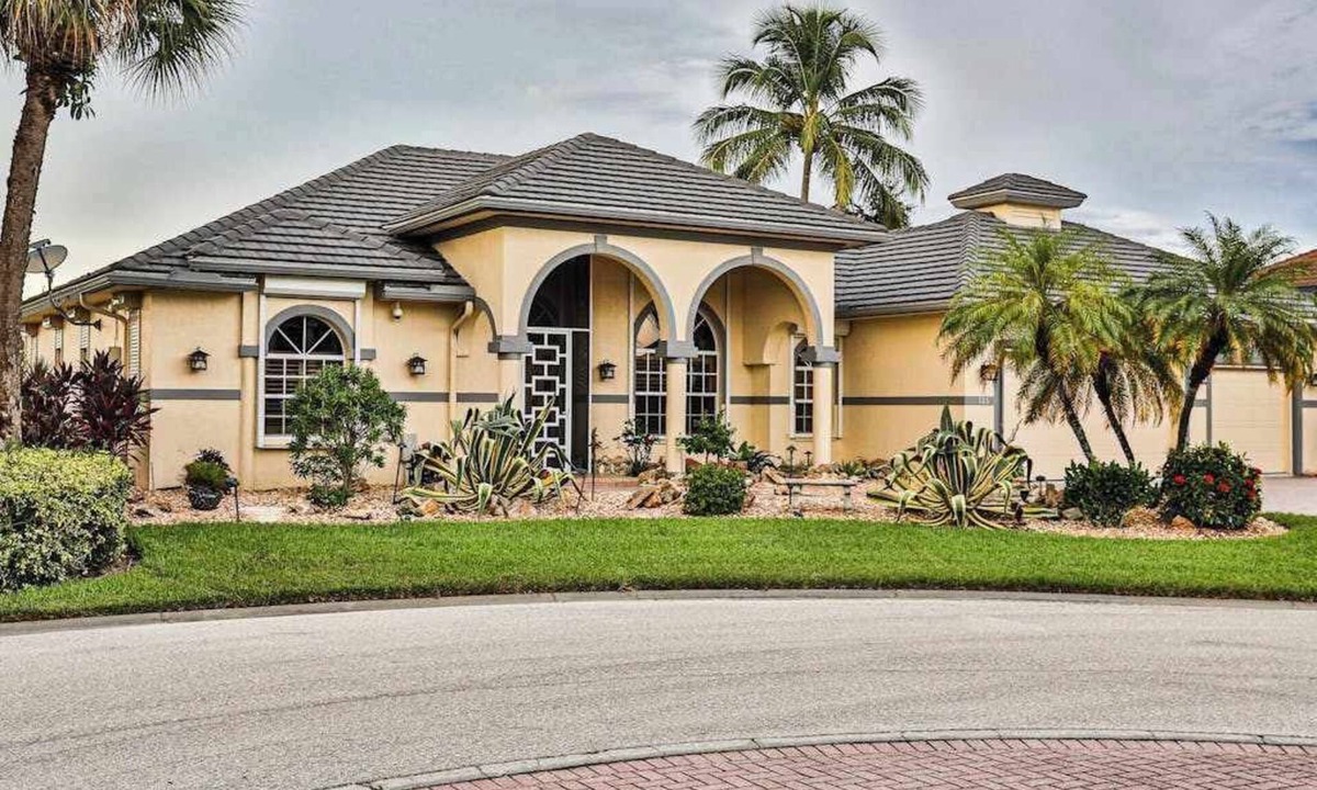 Naples House | Upscale waterfront home with private dock, saltwater pool, lanai, grill, & W/D