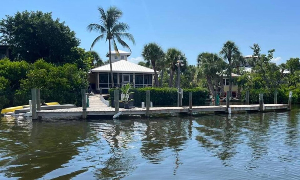 Placida House | Use our kayaks to explore; your boat is in view at our dock; boardwalk to beach