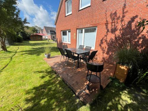 Bensersiel Apartment | Vier Nordlichter Erdgeschosswohnung mit Terrasse und Garten