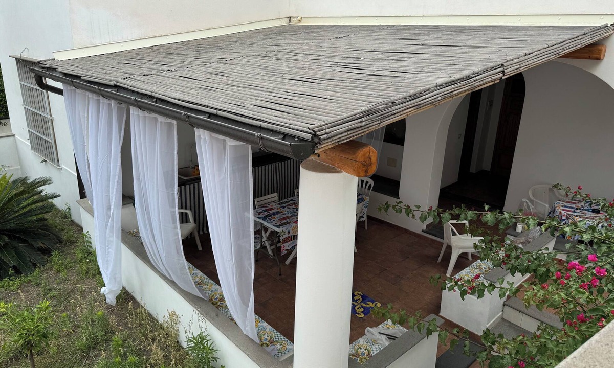 Stromboli Villa | Villa with patio surrounded by greenery, equipped kitchen on the patio. Close to the sea