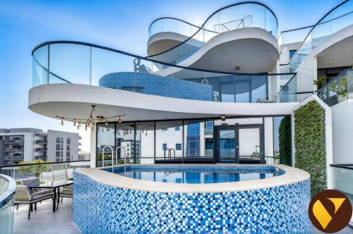 Dubai Apartment | Vogue Vacation Homes, Samana Golf Avenue Dubai Studio City near First Avenue Mall, Two Bedroom Apartment with Balcony and Private Pool, Access to all Amenities