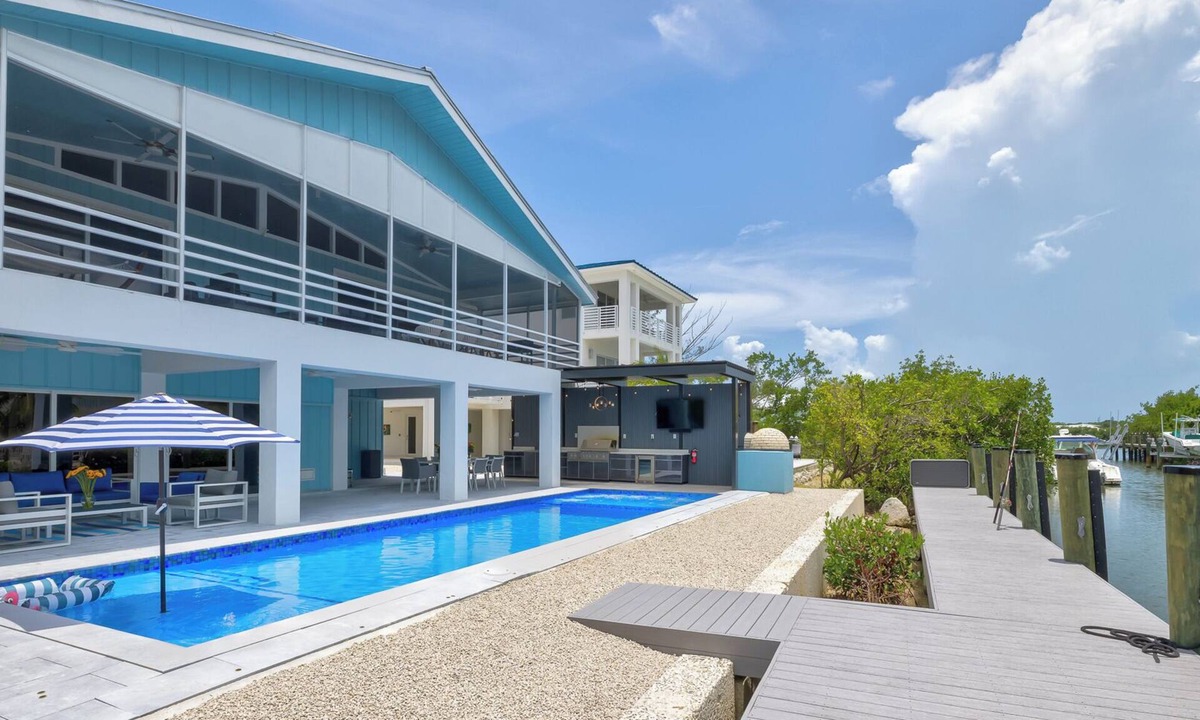 Pirates Cove House | Waterfront bayside oasis w/dock, pool, outdoor kitchen, pizza oven & fun