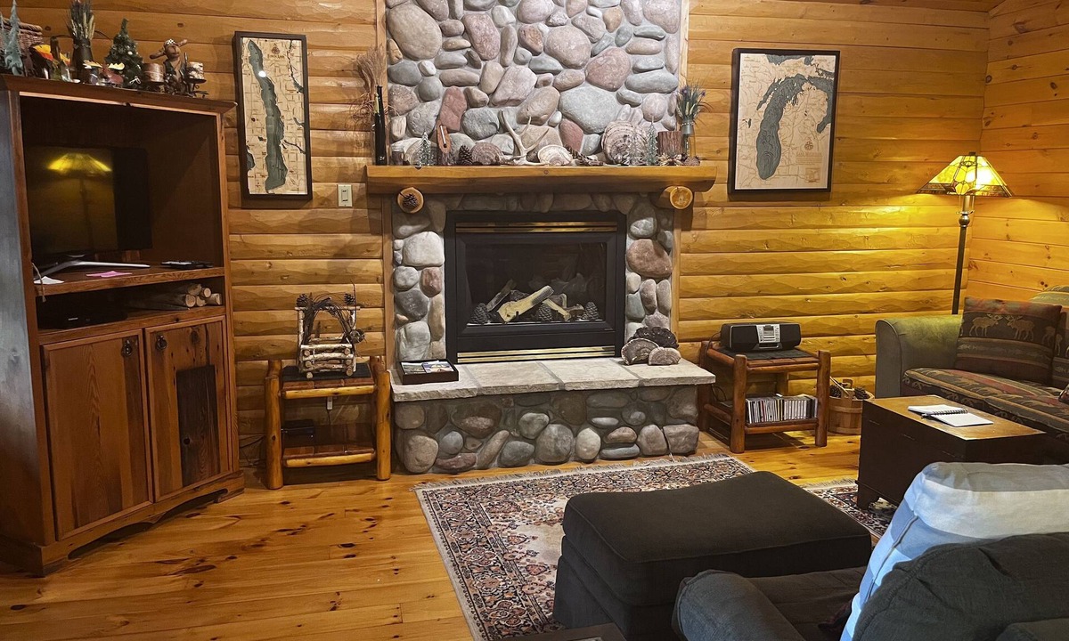 Bellaire House | Waterfront log home on Lake Bellaire. Pet friendly. Fireplace, dock. Dog ok