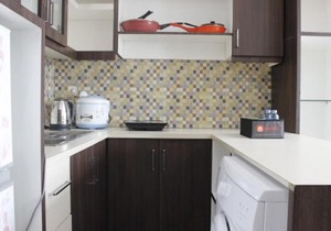 Modern Studio Room at Tamansari La Grande Apartment By Travelio