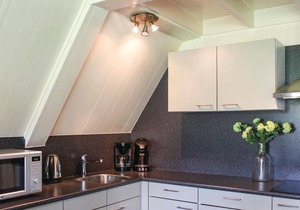 This beautifully situated vacation home is located on the waterfront in a welcoming vacation park in