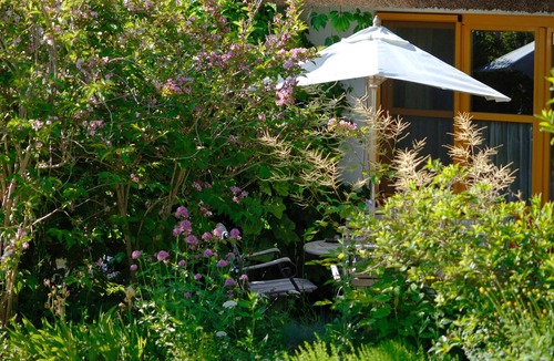 Lancken-Granitz Cottage | 01 Holiday apartment with garden terrace - Holiday apartments in the fishing village and under the