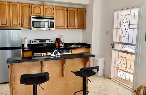 Kittian Village Condo | 1 king bed beachside condo