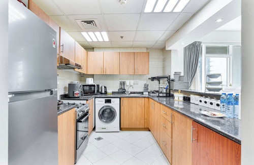 Dubai Sports City Apartment | 2-Bedroom Haven with Canal View near The Els Club