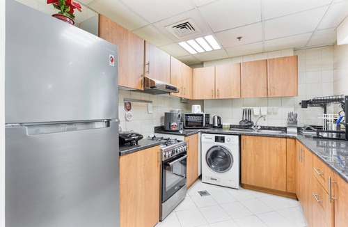 Dubai Sports City Apartment | 2-Bedroom Haven with Canal View near The Els Club