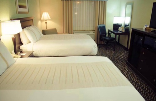 Devils Lake Hotel | 2 Queen Bed Suite near Ruger Park | Free Parking & Year-Round Indoor Pool!