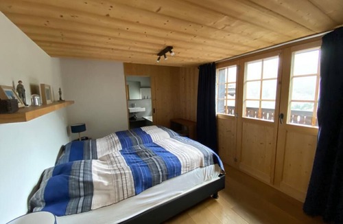 Grimentz Apartment | 2 storey apartment with 4 bedrooms and sauna for 9 persons : living room with woodstove - kitchen wi