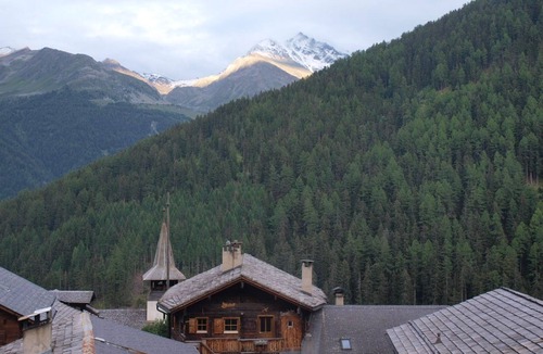 Grimentz Apartment | 2 storey apartment with 4 bedrooms and sauna for 9 persons : living room with woodstove - kitchen wi