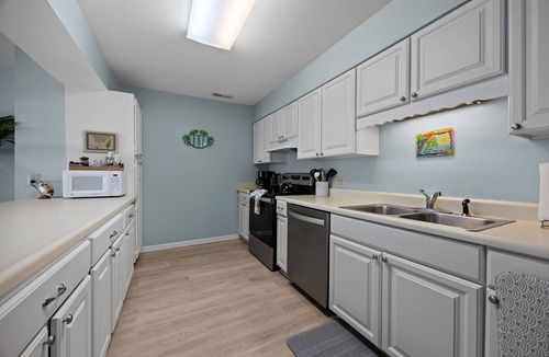 Indian Beach Condo | 2BR/2BA Colony By The Sea with ocean views, elevator & private balcony. Enjoy a king ensuite & twin guest room with TV's, full kitchen, washer/dryer, community pool, hottub, and direct beach access.